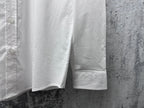 White shirt with straight hem and visible side panel seams