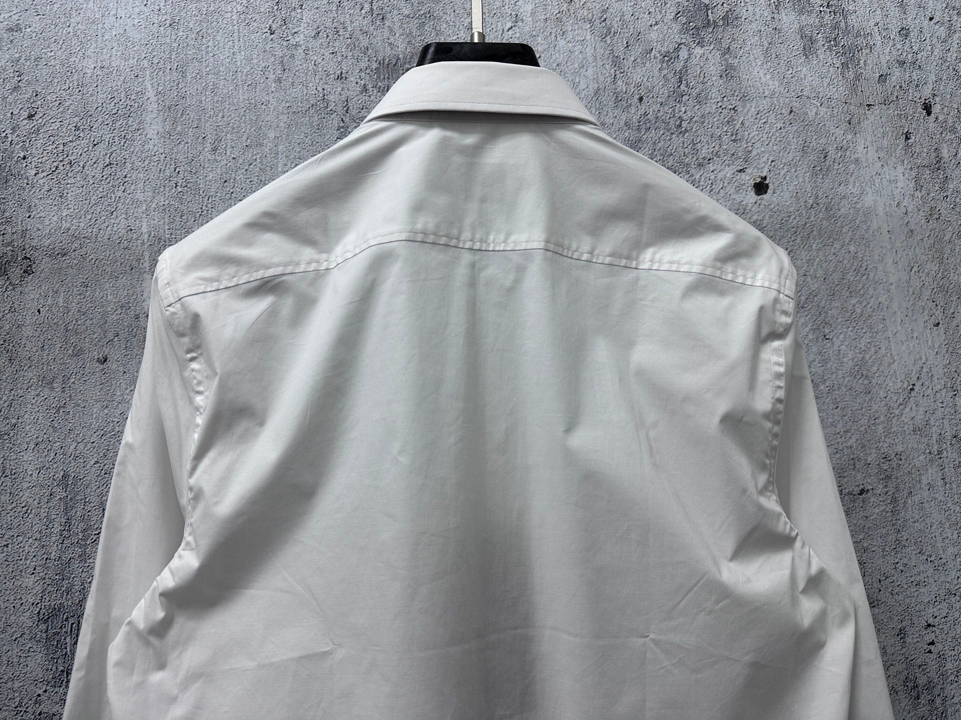 White long-sleeve shirt back with yoke seam and shoulder darts