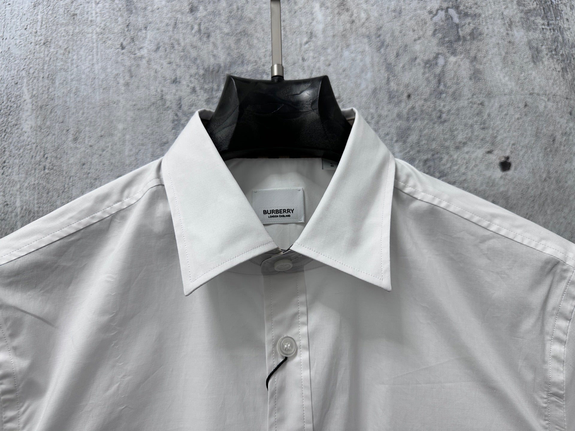 Burberry long-sleeve shirt, white, front view with collar and button placket