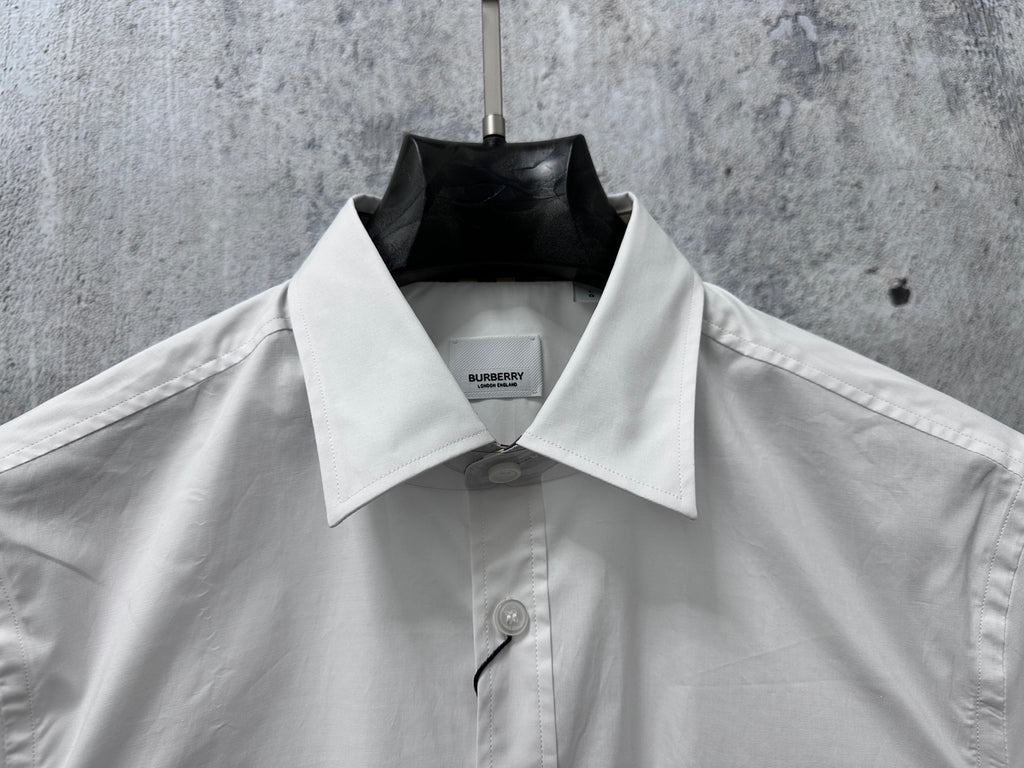 White long-sleeve shirt with pointed collar and center-front buttons