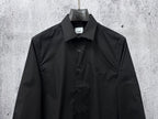 Burberry dark long-sleeve button-up shirt with chest pocket and center-front buttons