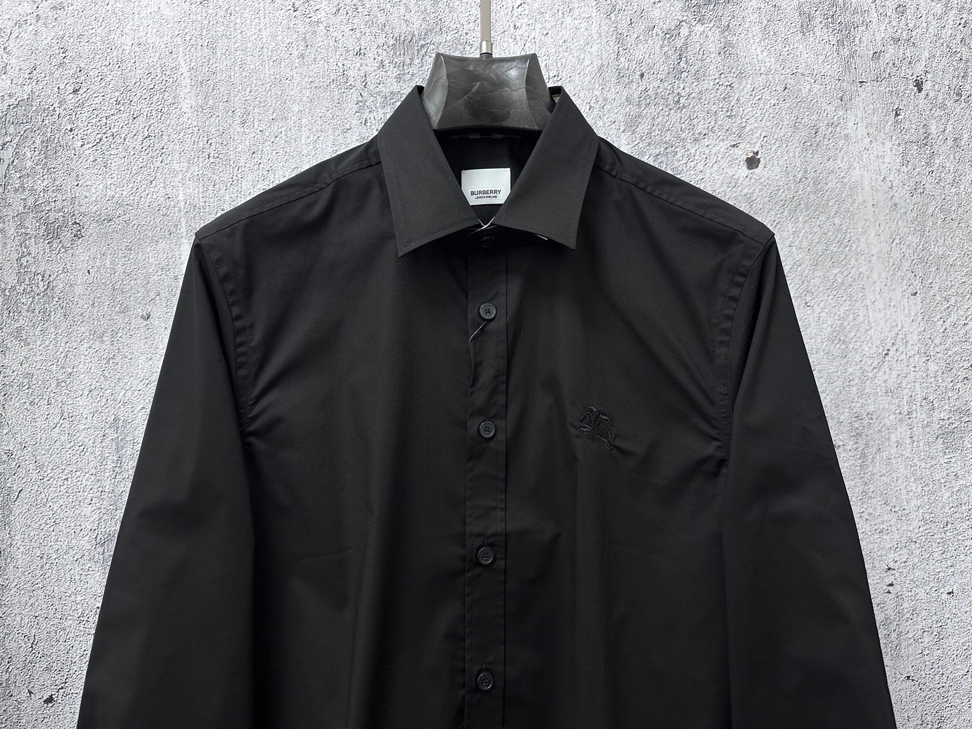 Burberry dark long-sleeve button-up shirt with chest pocket and center-front buttons