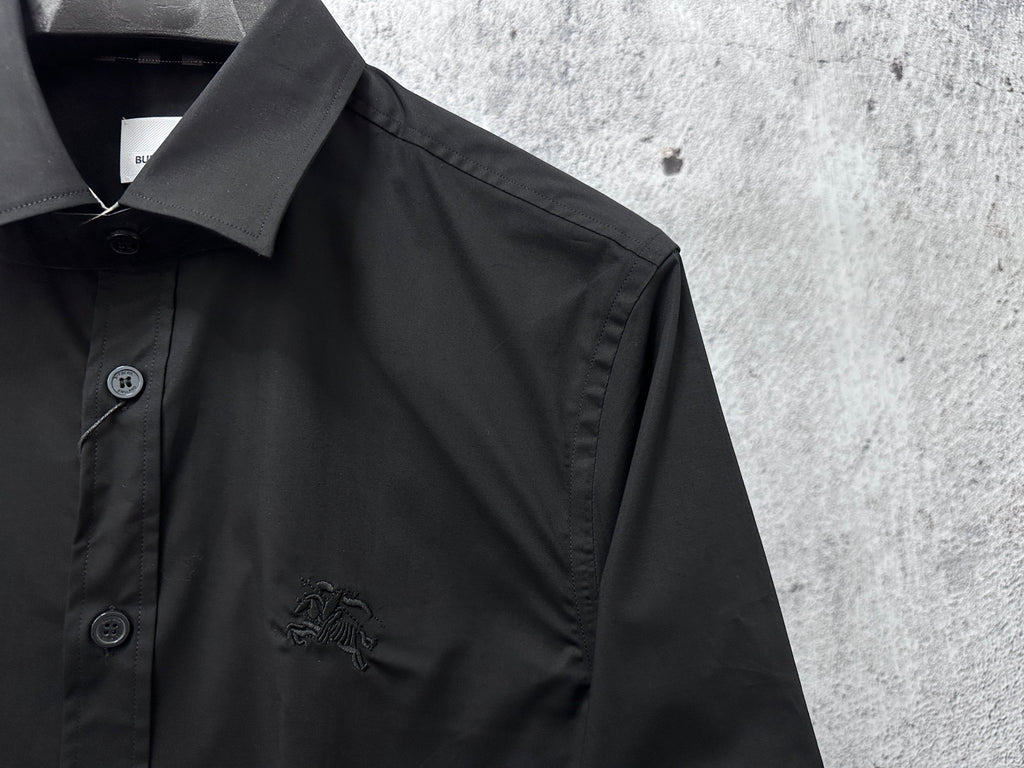 Burberry long-sleeve shirt, dark black, close-up of collar and engraved buttons