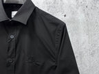 Burberry long-sleeve shirt, dark black, close-up of collar and engraved buttons