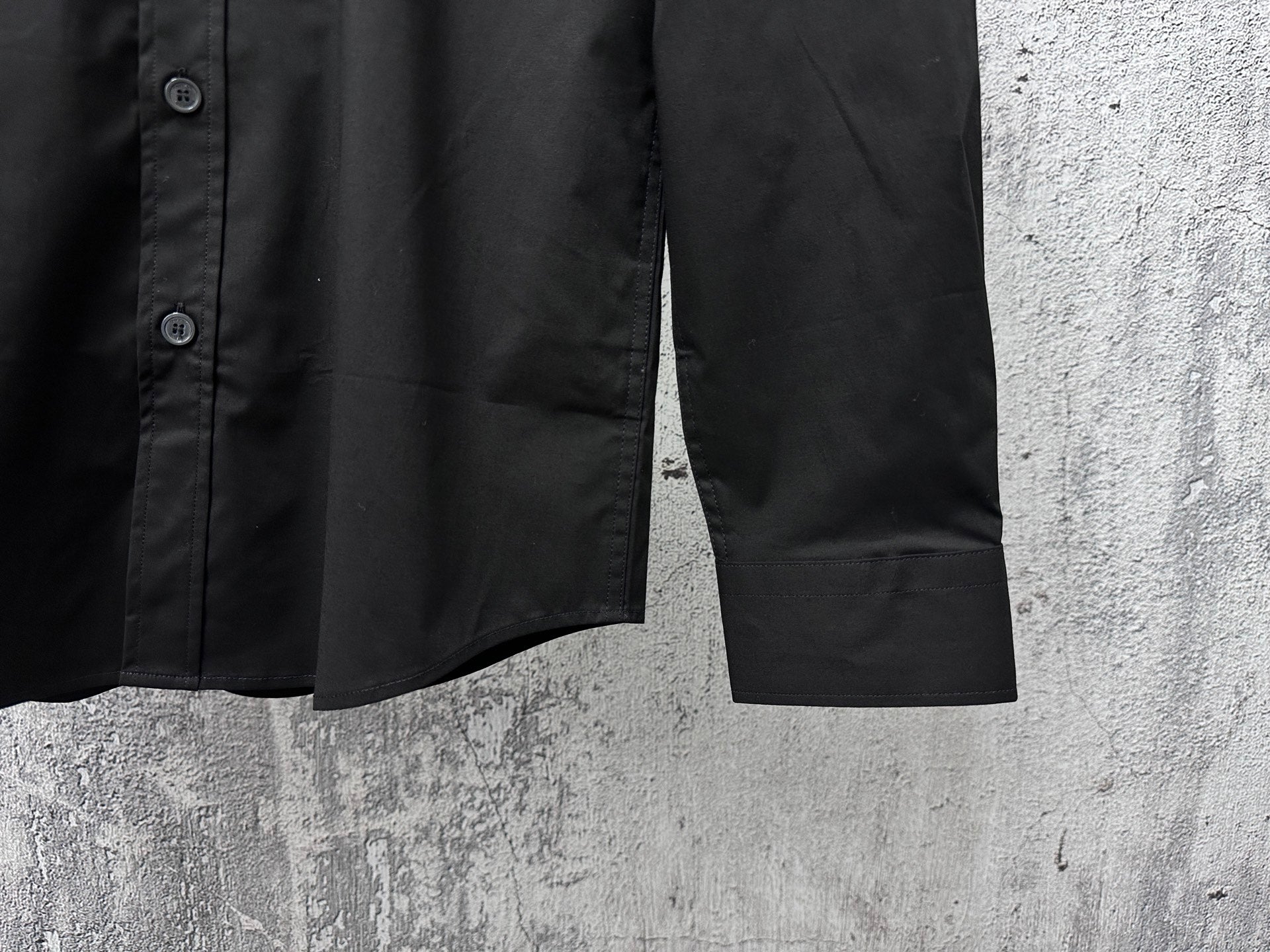 Burberry dark long-sleeve shirt lower front with side seam and button detail