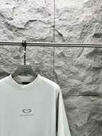 Balenciaga short-sleeve T-shirt in white with heart logo at chest, angled view