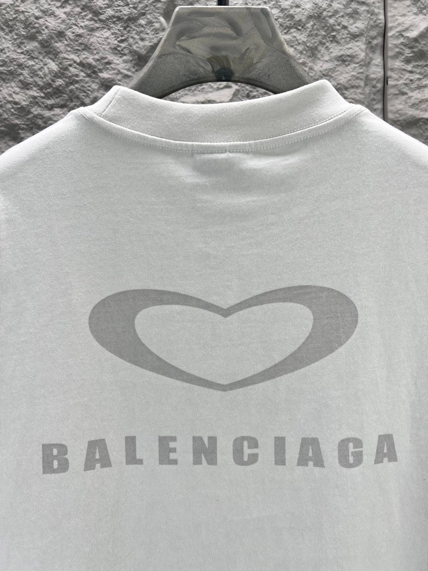 Balenciaga back logo on a white short-sleeve T-shirt with large heart and brand text