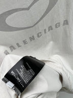 White Balenciaga T-shirt hem with black care label and small text