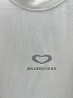 Balenciaga chest logo on a white short-sleeve T-shirt, heart icon and brand text