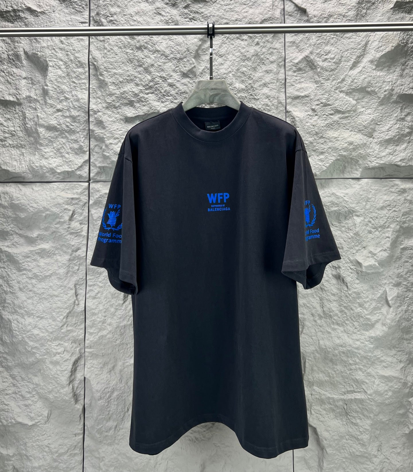 Black short-sleeve T-shirt with crew neck and blue WFP Balenciaga logo on chest