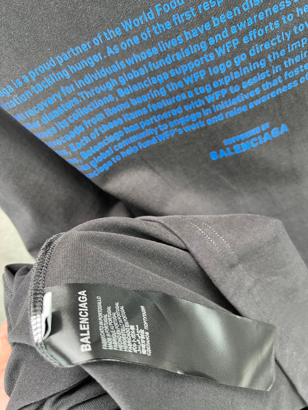 Gray T-shirt collar with inner label featuring BALENCIAGA text