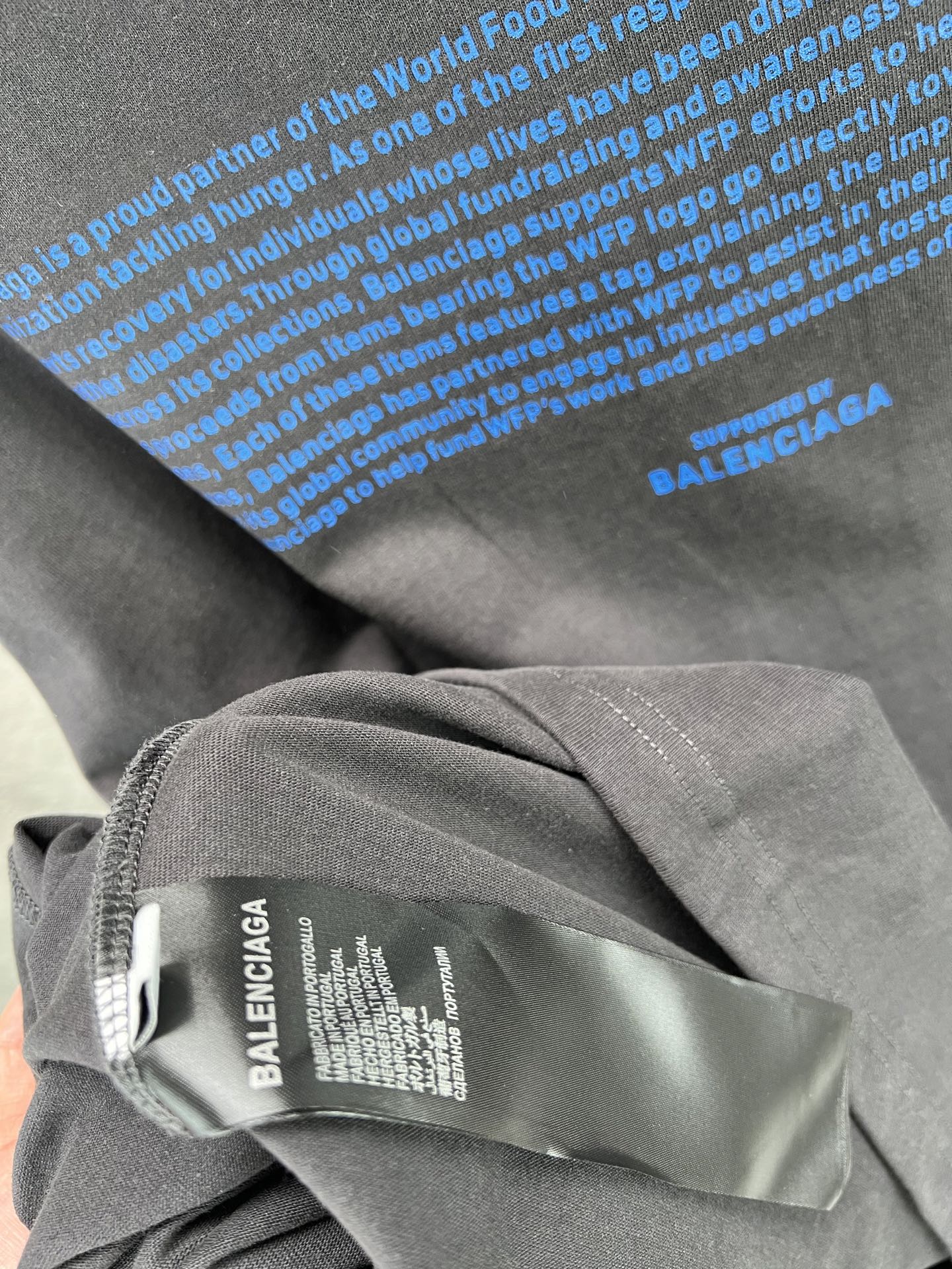 Gray T-shirt collar with inner label featuring BALENCIAGA text