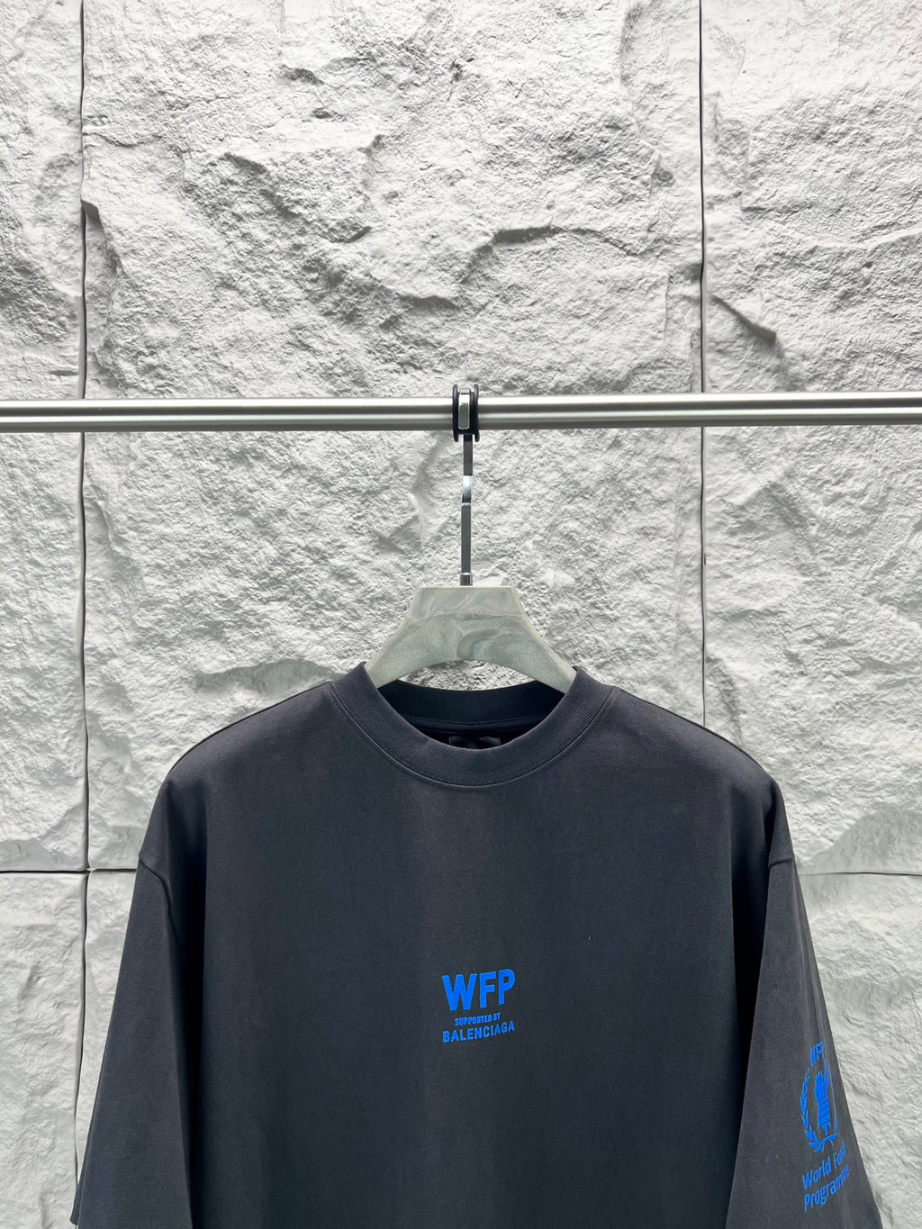Black short-sleeve T-shirt with crew neck and centered blue WFP Balenciaga logo
