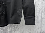 Burberry long-sleeve button-up shirt hem detail, black with side seam and pocket
