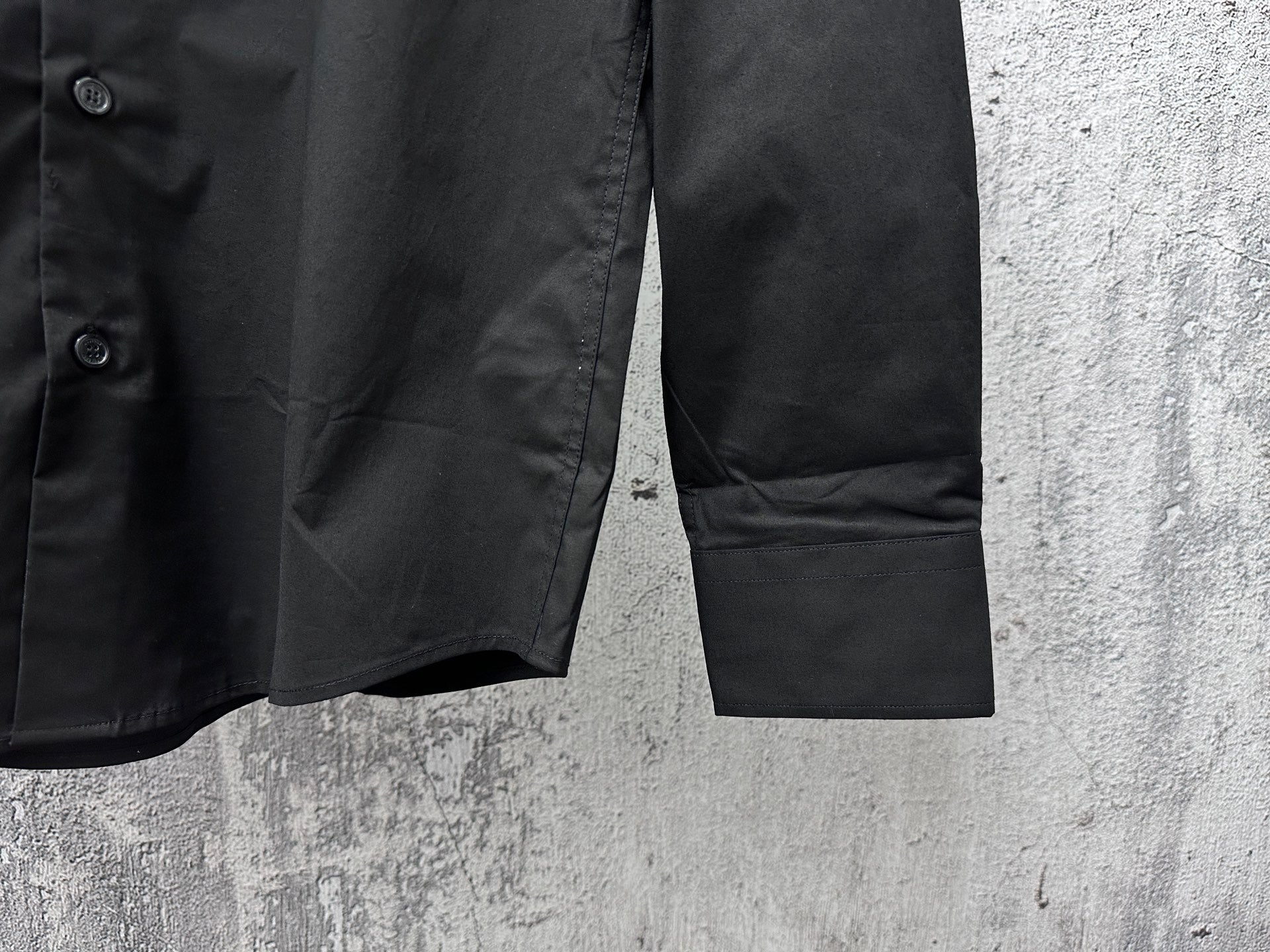 Burberry long-sleeve button-up shirt hem detail, black with side seam and pocket