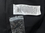 Burberry white care label inside black shirt with attached bag