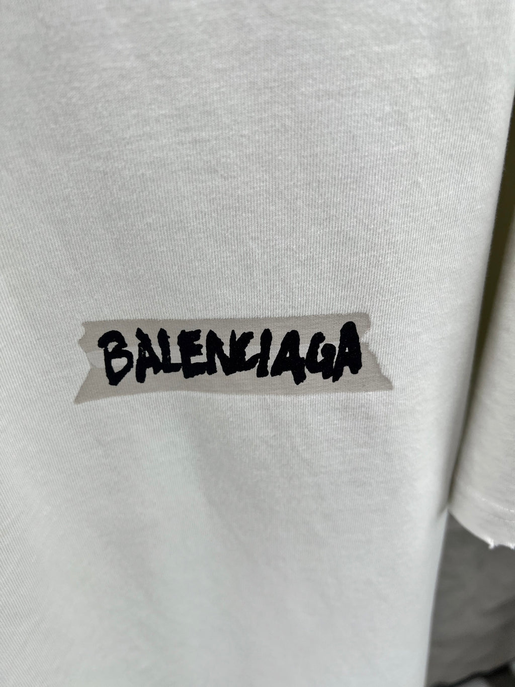 Light mint T-shirt with black Balenciaga logo print on chest
