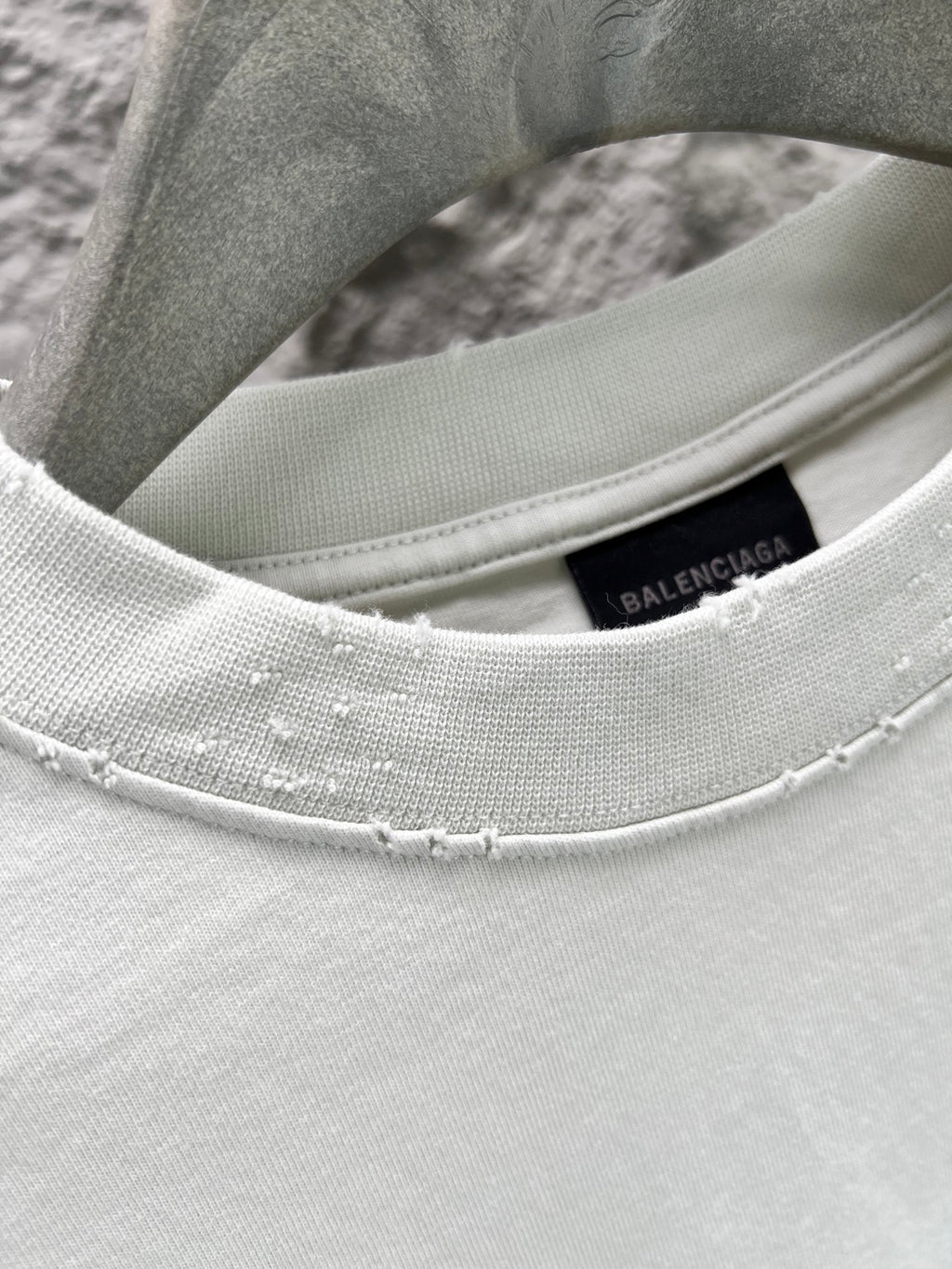 Ribbed crew-neck collar of light mint T-shirt with Balenciaga inner tag