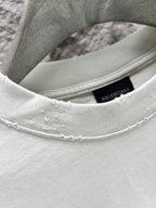 Ribbed crew-neck collar of light mint T-shirt with Balenciaga inner tag