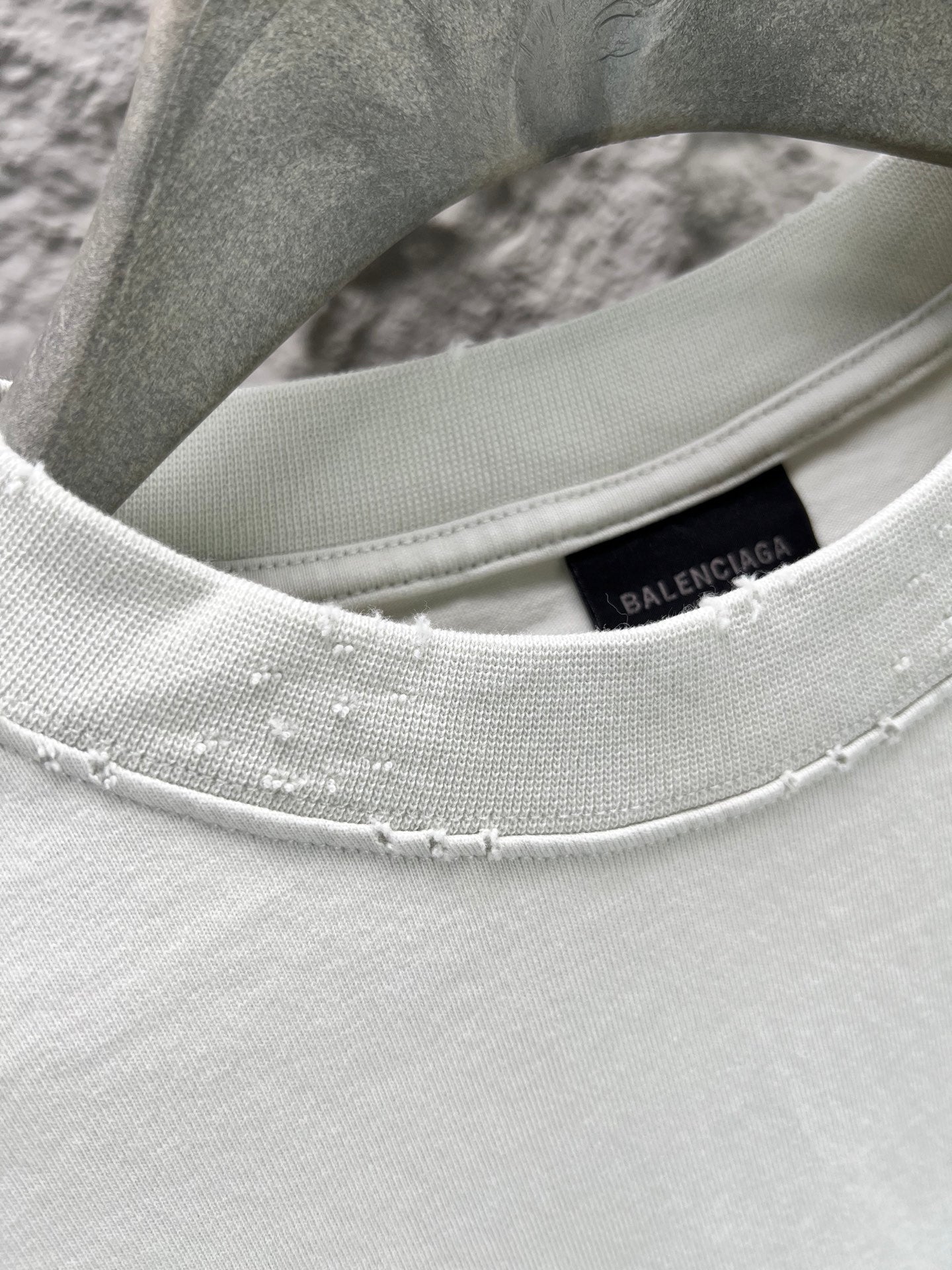 Ribbed crew-neck collar of light mint T-shirt with Balenciaga inner tag