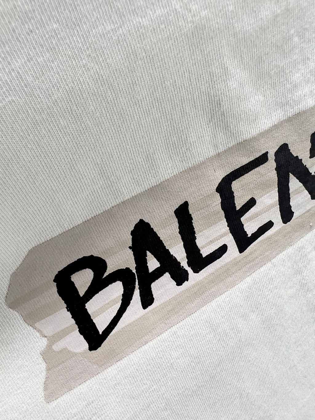 Black Balenciaga logo print on light mint T-shirt fabric