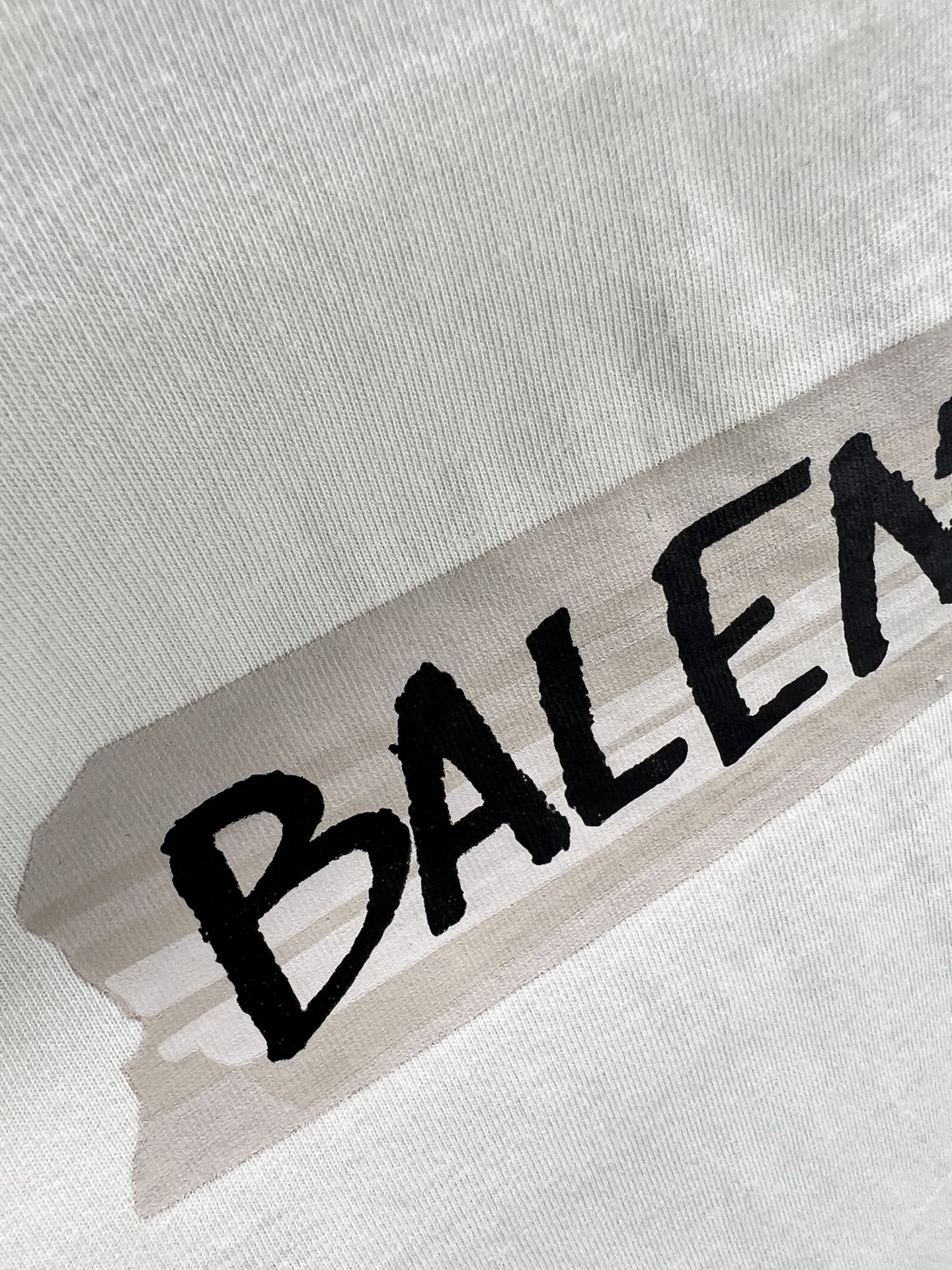 Black Balenciaga logo print on light mint T-shirt fabric