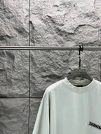 Light mint T-shirt with crew neck and small Balenciaga logo on sleeve
