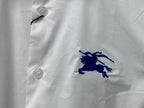 White shirt front with button placket and embroidered blue horse logo