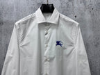 White long-sleeve button-up shirt with blue horse logo and button front