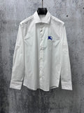 White long-sleeve button-up shirt with blue horse logo on chest