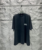 Dark charcoal Balenciaga logo T-shirt with short sleeves and crew neck