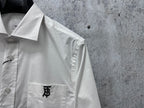 Long-sleeve button-up shirt collar, white, with small neck label and button