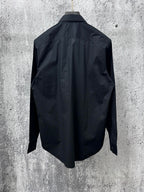 Long-sleeve button-up shirt, dark; plain back view with yoke seam