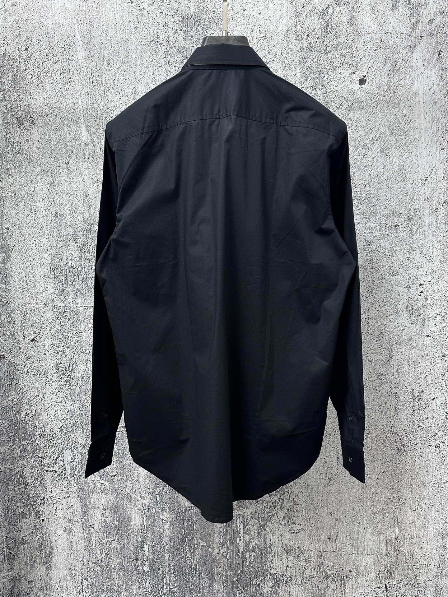 Long-sleeve button-up shirt, dark; plain back view with yoke seam