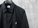 Burberry long-sleeve shirt front close-up with button placket and chest logo