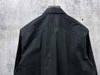Long-sleeve button-up shirt back view, dark with collar and shoulder yoke seams