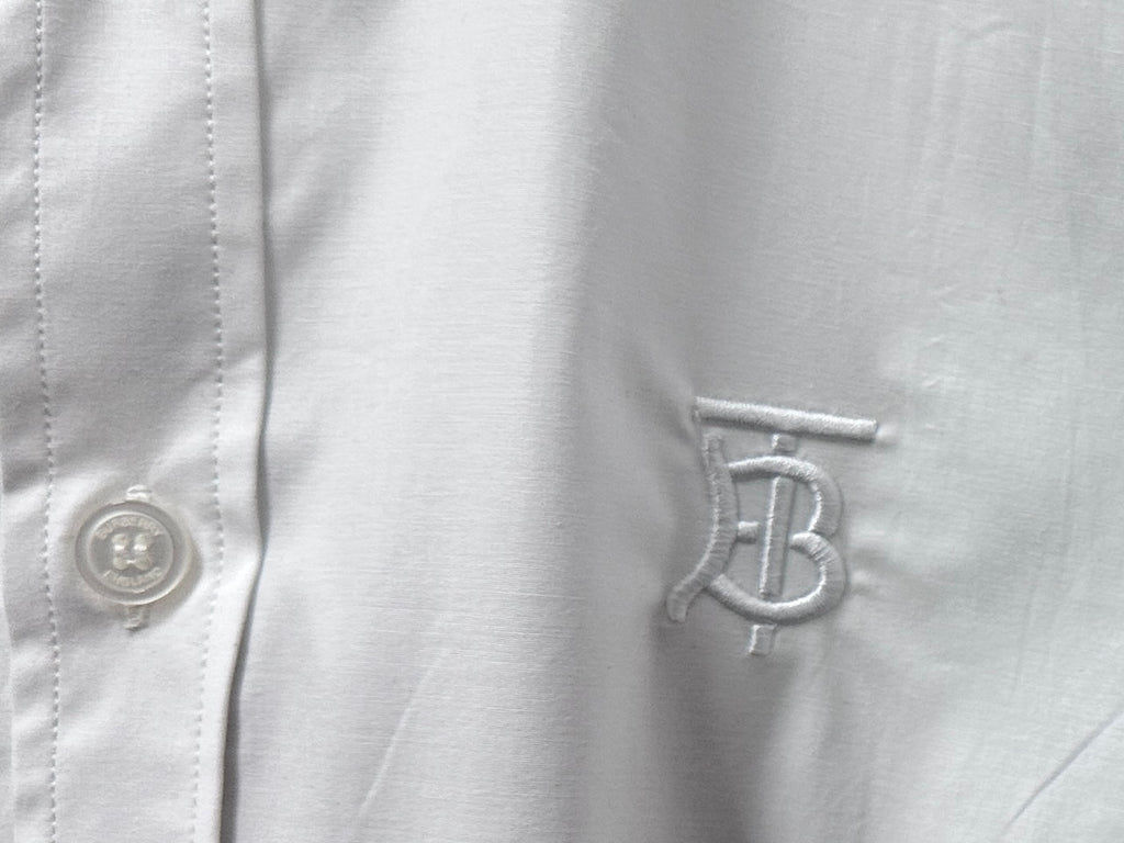 Burberry white shirt chest monogram patch and button close-up