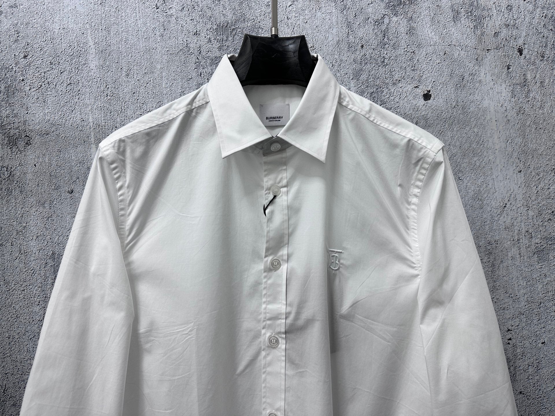 Burberry white long-sleeve button-up shirt with pointed collar and chest monogram