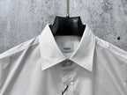 Burberry white dress shirt collar close-up with button placket and neck label