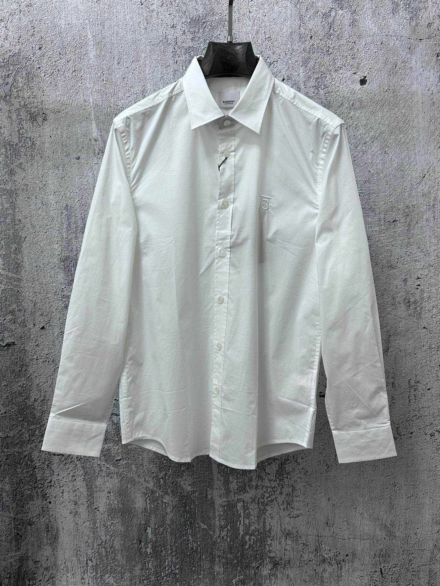 Burberry white long-sleeve button-up shirt with pointed collar and front buttons