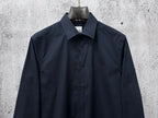 Navy long-sleeve button-up shirt, chest logo and four-button front