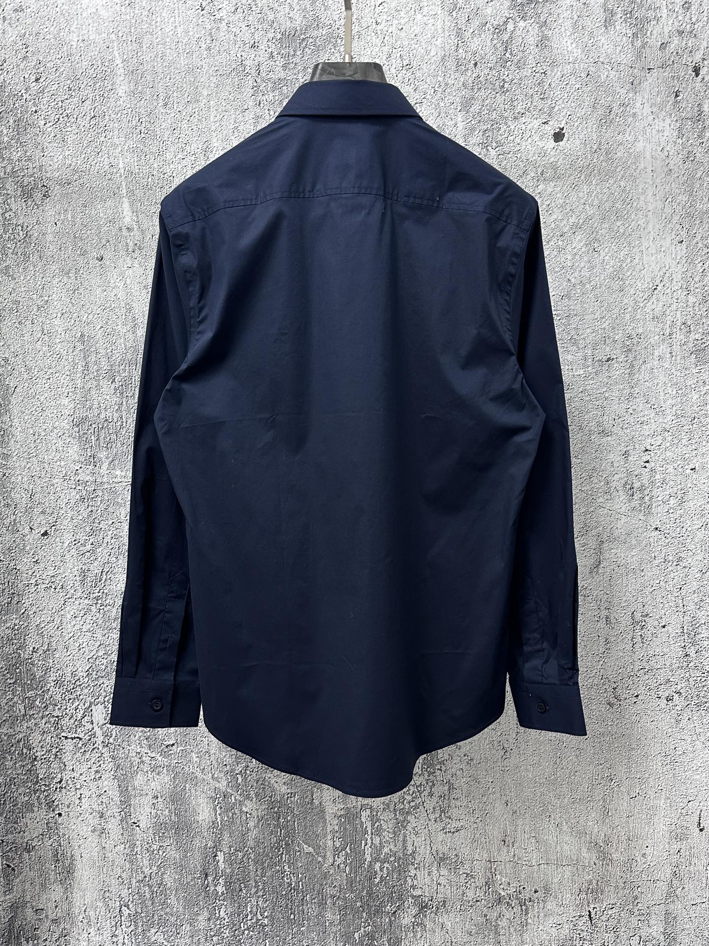 Navy long-sleeve button-up shirt, back view with yoke and seam details