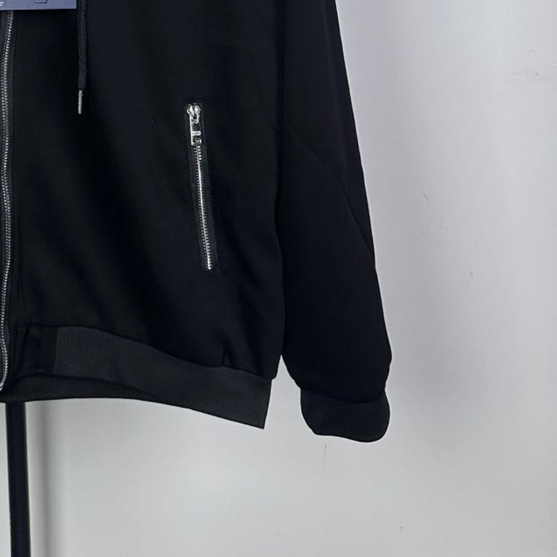 Black Prada zip-up hoodie with front side zip pocket and ribbed cuffs
