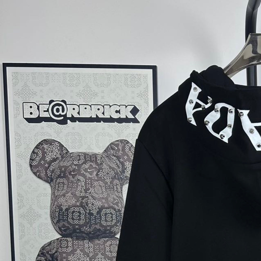 Black Prada hoodie with drawstring hood and white-and-black graphic detail