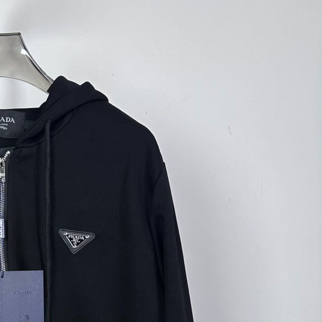 Black Prada zip-up hoodie with triangle chest logo and adjustable drawstring hood