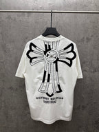White short-sleeve T-shirt, back view, with large sunburst cross embroidery and text at hem.