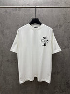 White short-sleeve T-shirt with small embroidered cross graphic on the chest.