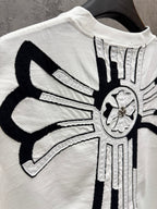 White T-shirt back close-up with crossburst graphic and circular emblem