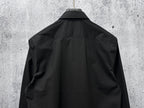 Black button-up shirt, back view with center yoke and shoulder shaping