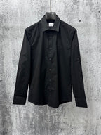Burberry long-sleeve button-up shirt in black, front view with stand collar
